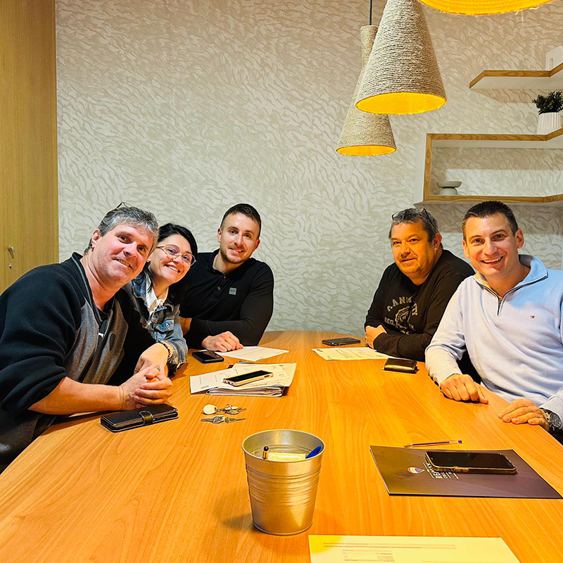 Property hunter with his clients at the notary's office