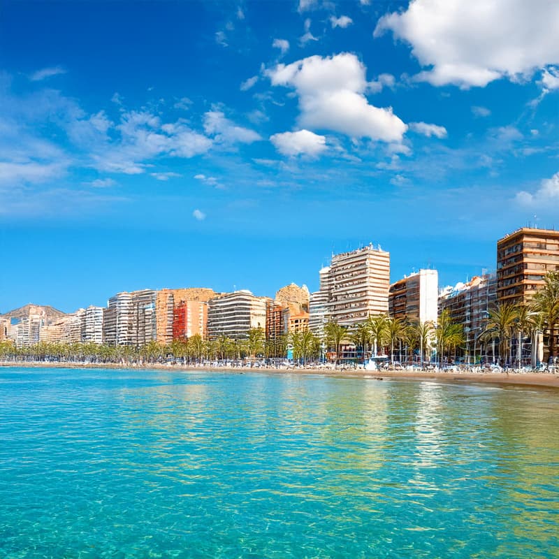 Beautiful Spanish waterfront with turquoise sea and seaside buildings