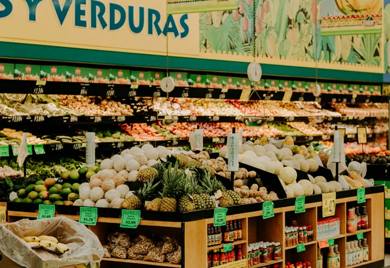 spanish-supermarket-fruits-vegetables-cost-of-living Fruit and vegetable section in a Spanish supermarket, reflecting daily grocery expenses