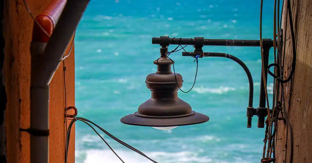 Vintage lamp with view of the Mediterranean Sea, symbolizing seaside real estate in Spain in 2025