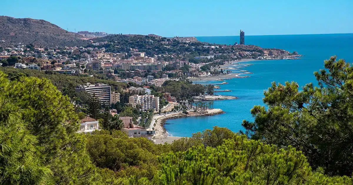 spanish-coast-real-estate-seaside-2025 Panoramic view of the Spanish coastline with beaches and houses, representing seaside real estate in Spain in 2025